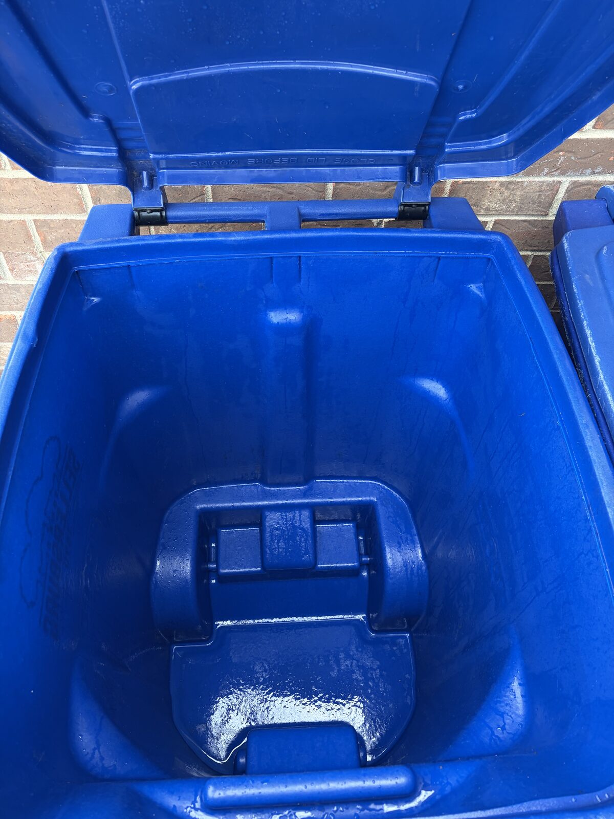 Same trash can spotlessly clean after Bin Brilliant pressure wash